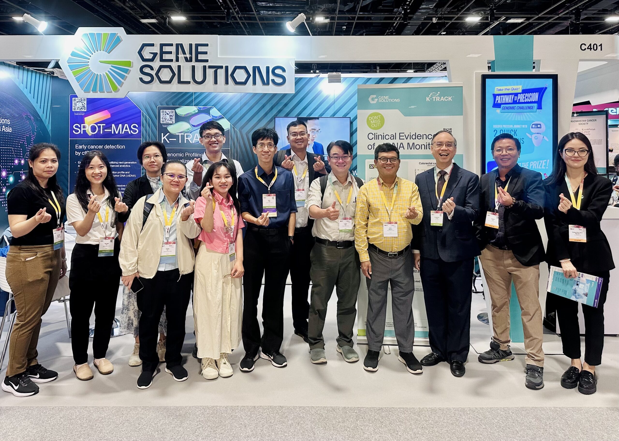 A group photo of the Gene Solutions team at ESMO Asia 2024, presenting advanced cancer research topics including early detection, personalized oncology, and neoantigen immunotherapy